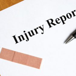 filling out an injury report first aid