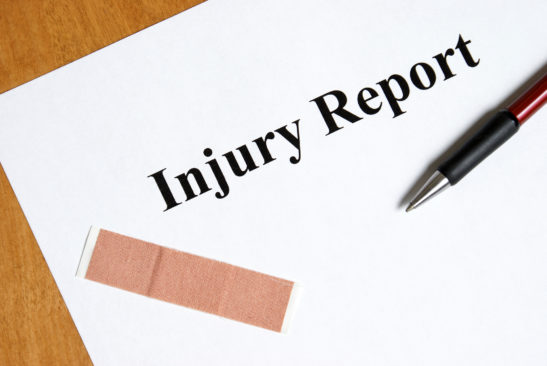 filling out an injury report first aid